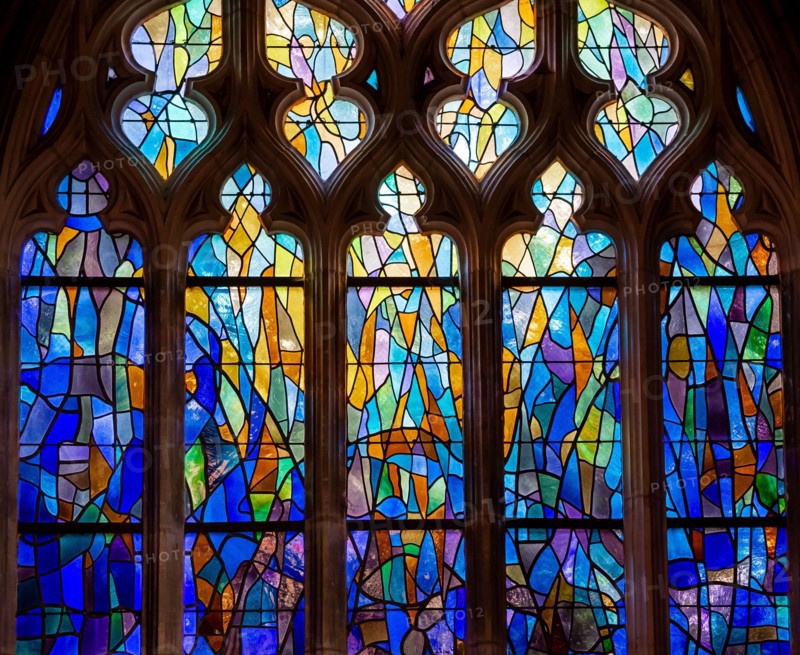 ABBEVILLE, SOMME, FRANCE, JUNE 20, 2023 :  details of stained glasses windows in Saint Sepulcre church, by Alfred Manessier workshop, year 1989  to 19