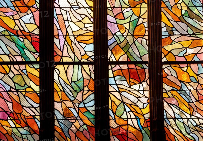 ABBEVILLE, SOMME, FRANCE, JUNE 20, 2023 :  details of stained glasses windows in Saint Sepulcre church, by Alfred Manessier workshop, year 1989  to 19