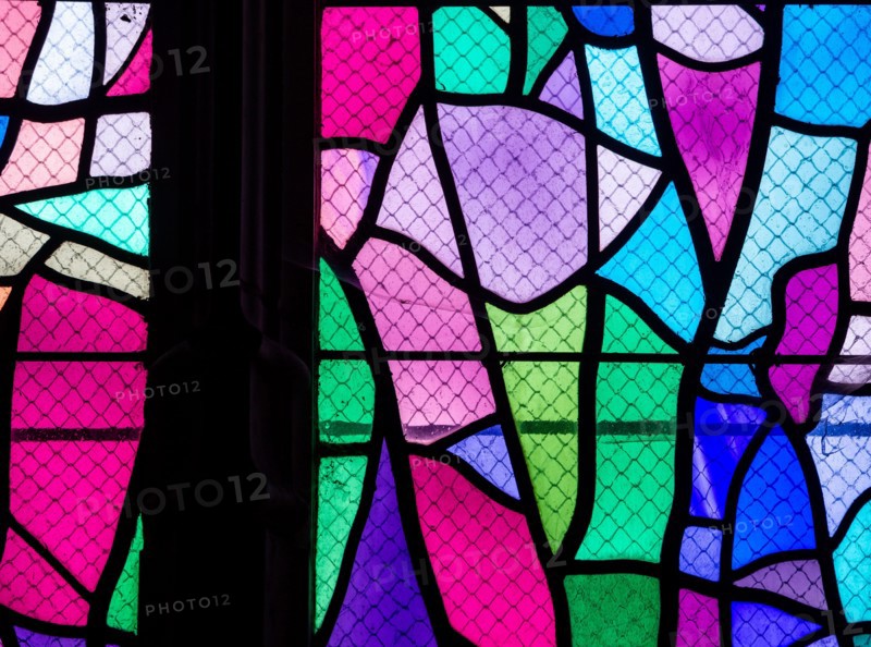 ABBEVILLE, SOMME, FRANCE, JUNE 20, 2023 :  details of stained glasses windows in Saint Sepulcre church, by Alfred Manessier workshop, year 1989  to 19