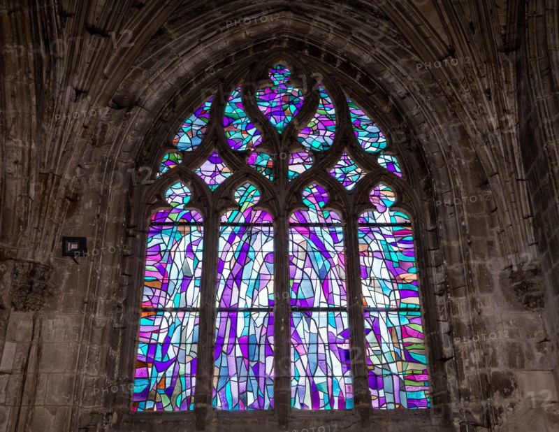 ABBEVILLE, SOMME, FRANCE, JUNE 18, 2023 :  details of stained glasses windows in Saint Sepulcre church, by Alfred Manessier workshop, year 1989  to 19