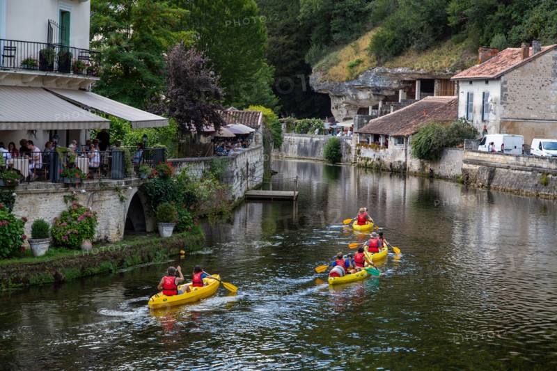 Messing about on the river! Canoists on the River Dronne in Brantome, Dordogne, France