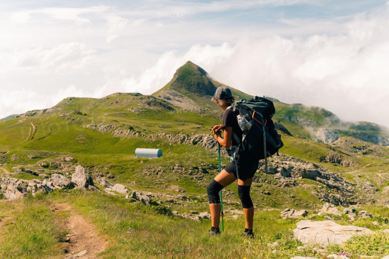 girl Hiker on countryside landscape in the Pyrenees, Pyrenees in France. High quality photo