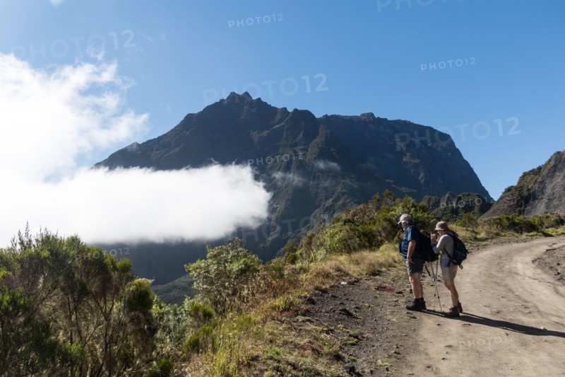 Hikers on a mountainous road on Reunion Island.