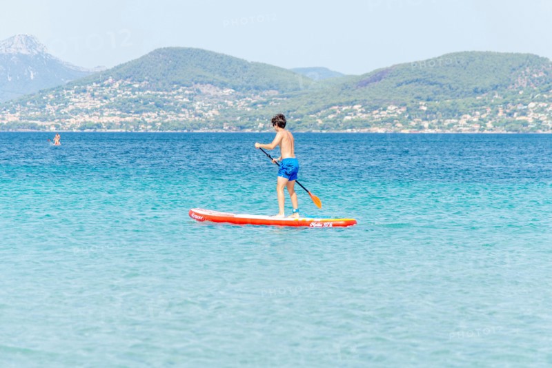 Stand-up paddling in the bay of Almanarre near Giens, southern France