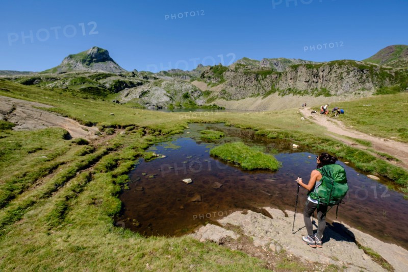 hikers on Lac du Miey, Ayous lakes tour, Pyrenees National Park, Pyrenees Atlantiques, France