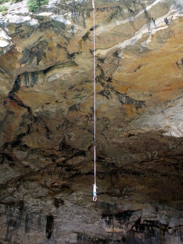 france pyrenees ariege grotte de mas d'asil cave with road through it bungee jumper