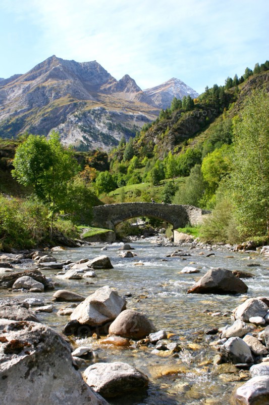 Bridge over stream Gavarnie foothills of Pyrenees France