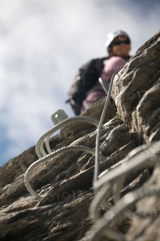 A close-up of the handles embedded in the rock for the sport of Via Ferrata.