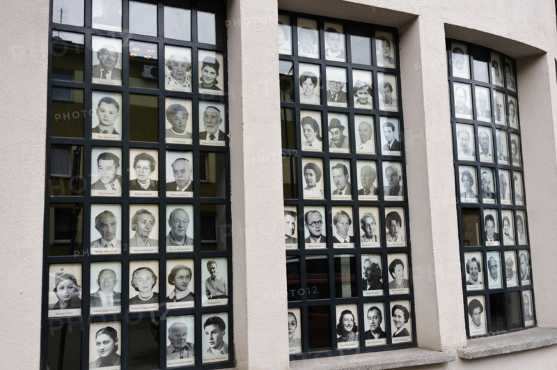 Pictures of Jewish victims of the Nazi holocaust on the windows of the Oskar Schlinder factory, Krakow