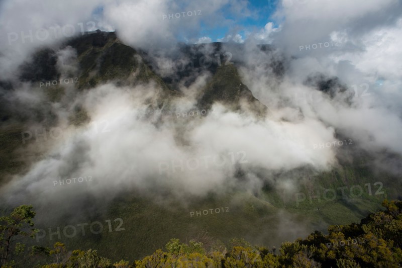 Views from Morne Langevin. The Morne Langevin is a mountain peak on the island of Reunion, a French overseas department in the Indian Ocean sea. Located in the municipality of Saint-Joseph, which rises to 2380 meters along the cliff instead of plain Remparts River dominates Langevin sources, a river of Piton de la Fournaise s' flowing from the north to the wild south. It is reached by a trail that runs along the wall of the Sands of mountain pass called non Sables.