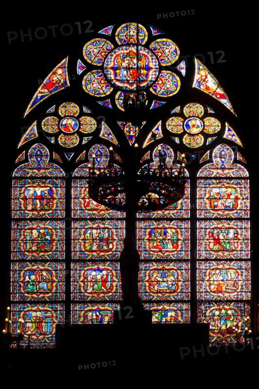 Stained glass window on southern facade of Notre Dame cathedral in Paris, France.