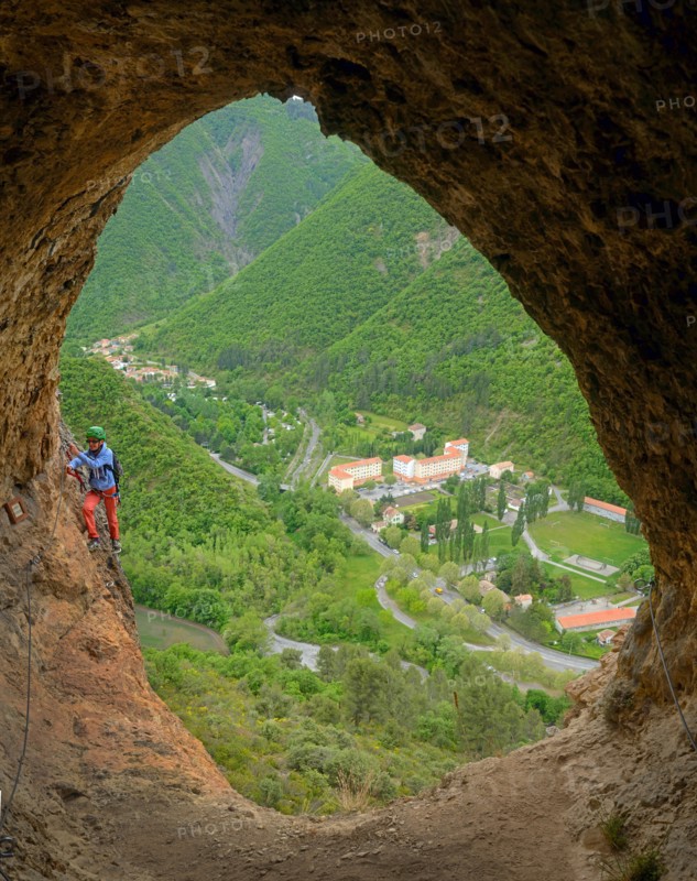 climber in a rock window, Via ferrata du Rocher de Neuf Heures, France, Provence, Digne-les-Bains