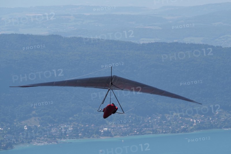 Hang glider flying above Lake Annecy France