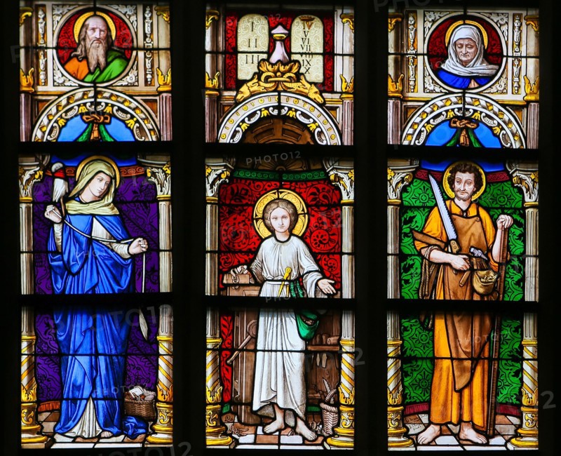Stained Glass window in the 15th Century Elzenveld Chapel in Antwerp, Belgium, depicting Mother Mary, Jesus and Saint Joseph