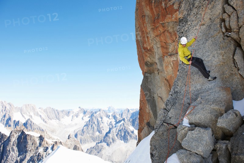 Mountaineer using climbing rope, Chamonix, Haute Savoie, France