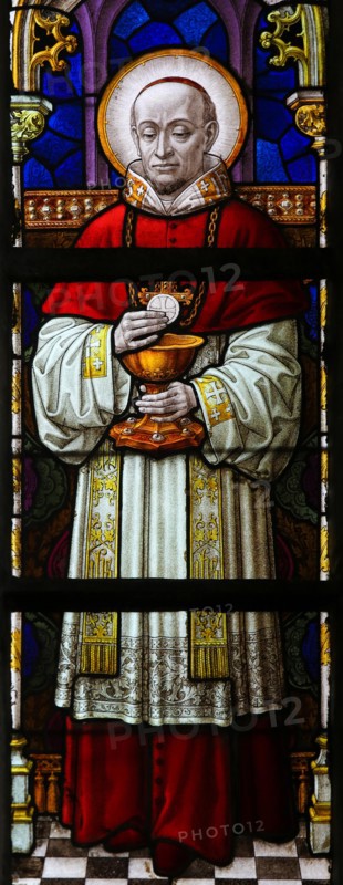 Stained Glass window in St Gummarus Church in Lier, Belgium, depicting a Cardinal holding a Host for Holy Communion