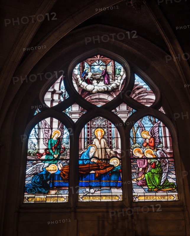 Paris, France - January 7, 2018: Beautiful stained glass window inside Notre Dame de Paris.