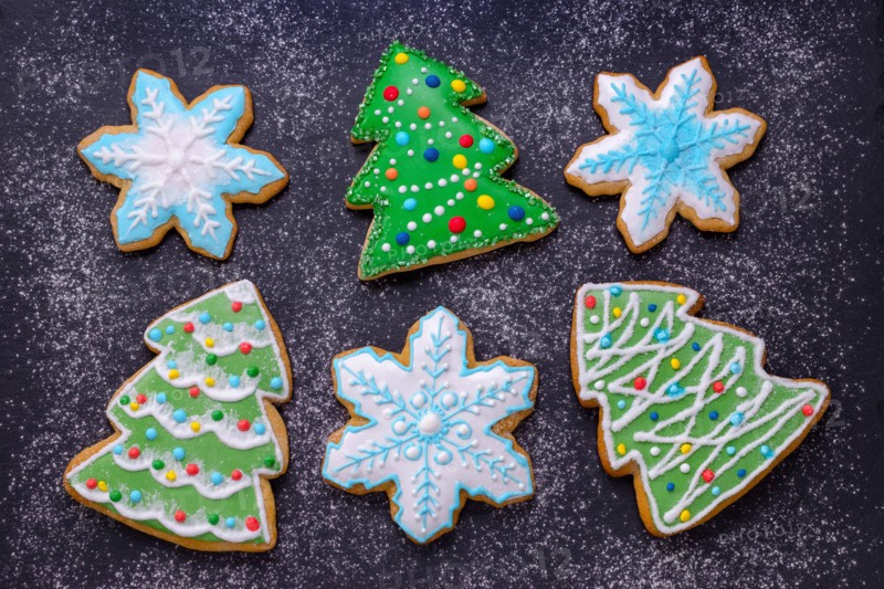 christmas food, handmade cookies gingerbread like christmas tree and snowflakes with flour like snow