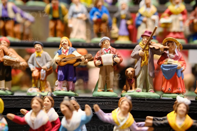 Large display of Santon figurines for sale in a market booth  at the Strasbourg Christmas Market