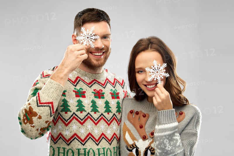 happy couple at christmas ugly sweater party