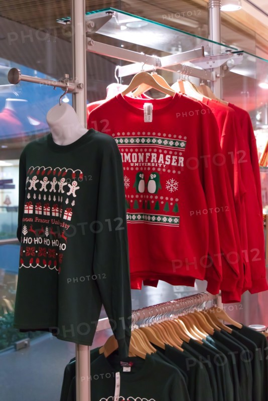 Burnaby, Canada - December 11, 2019: Colourful Christmas ugly sweaters for sale are available at Simon Fraser University bookstore