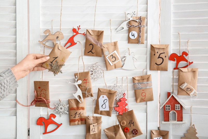 Woman making Christmas advent calendar