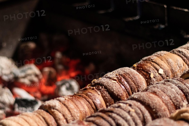 Close-up image of a typical Czech dessert called trdelnik in preparation