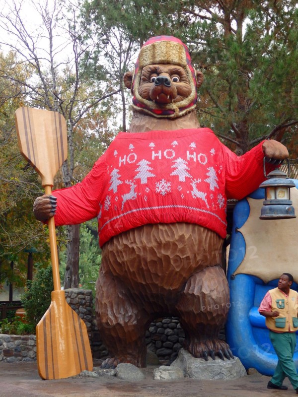 Giant bear wearing an ugly Christmas sweater at the Grizzly River Run, Disney California Adventure Park, Anaheim California, United States