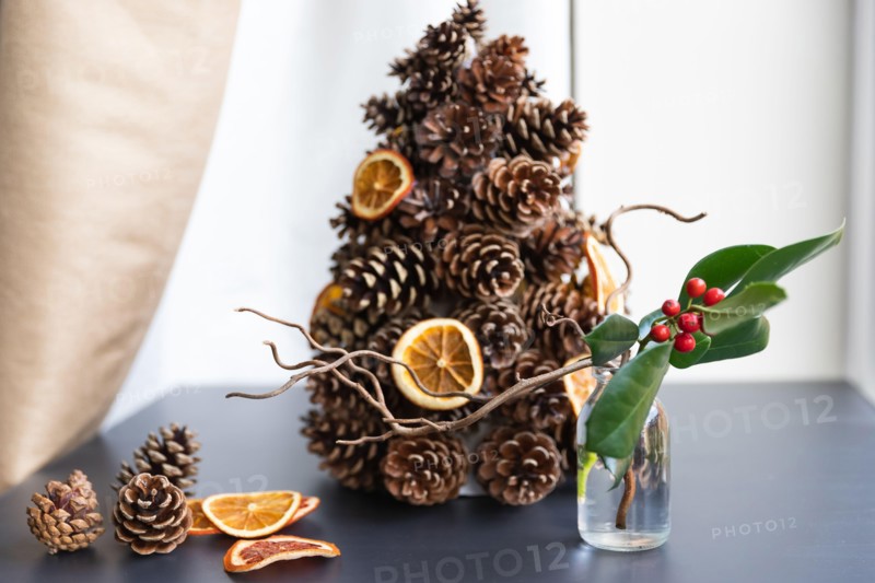 alternative Christmas tree from pine cones with dried orange slices decoration makes perfect eco zero waste decor