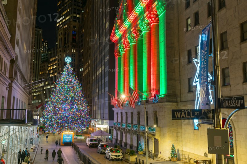 Christmas tree glows at front of NYSE during Pandemic of COVID-19 2020 NYC.