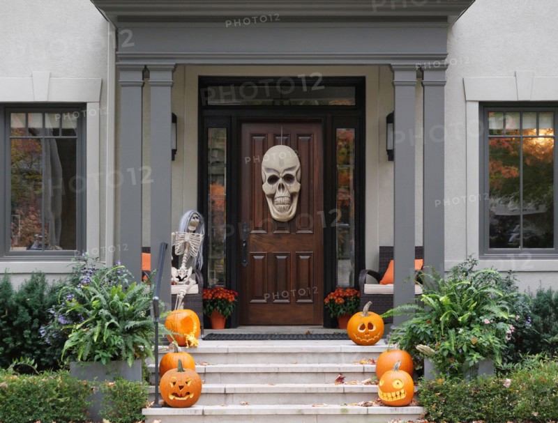 Halloween decorations on front porch and steps of house
