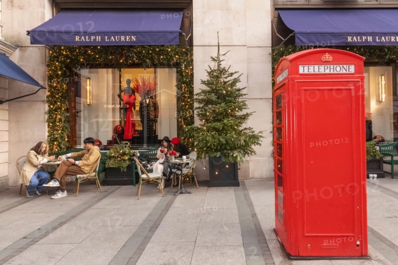 England, London, Piccadilly, New Bond Street, Exterior View of Ralph Lauren Store with Christmas Decorations and Traditional Red Telephone Box