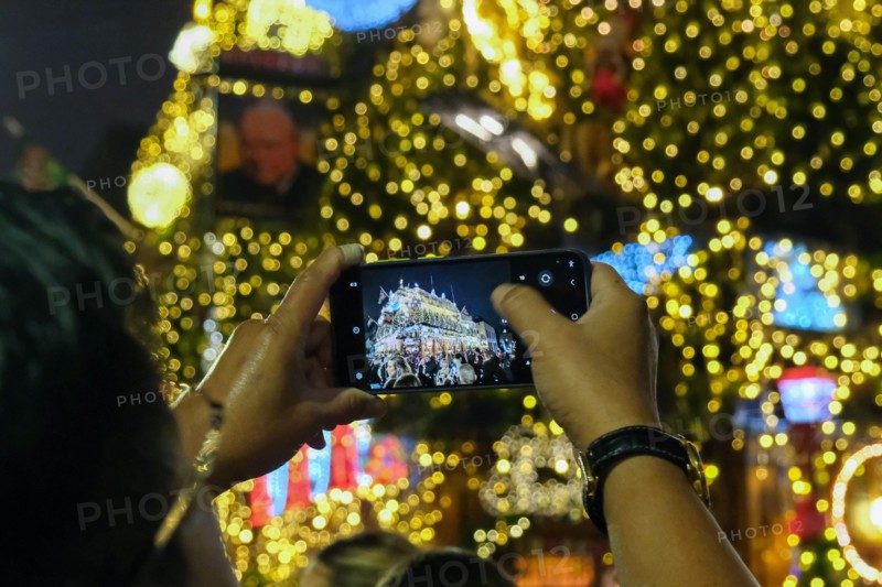 London, UK. 14th November, 2024. The Churchill Arms in Kensington switches on its festive light display with the external walls covered in over 80 Christmas trees and decorations. The pub attracts many visitors with its impressive seasonal floral and plant displays all year round.  Credit: Eleventh Hour Photography/Alamy Live News