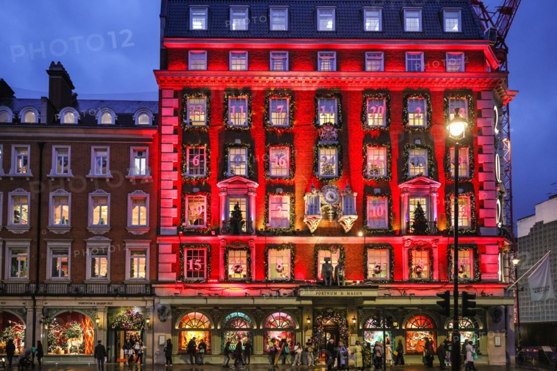 London, UK. 18th Nov, 2024. The annual 'advent calendar' facade decorations and 2024 display glows in festive red on the Fortnum and Mason building in Piccadilly. Christmas Lights, baubles and elaborate decorations have been put up along Bond Street and its luxury shops, Piccadilly, Burlington Arcade and all through Mayfair in anticipation of the the busy Christmas shopping season. Credit: Imageplotter/Alamy Live News