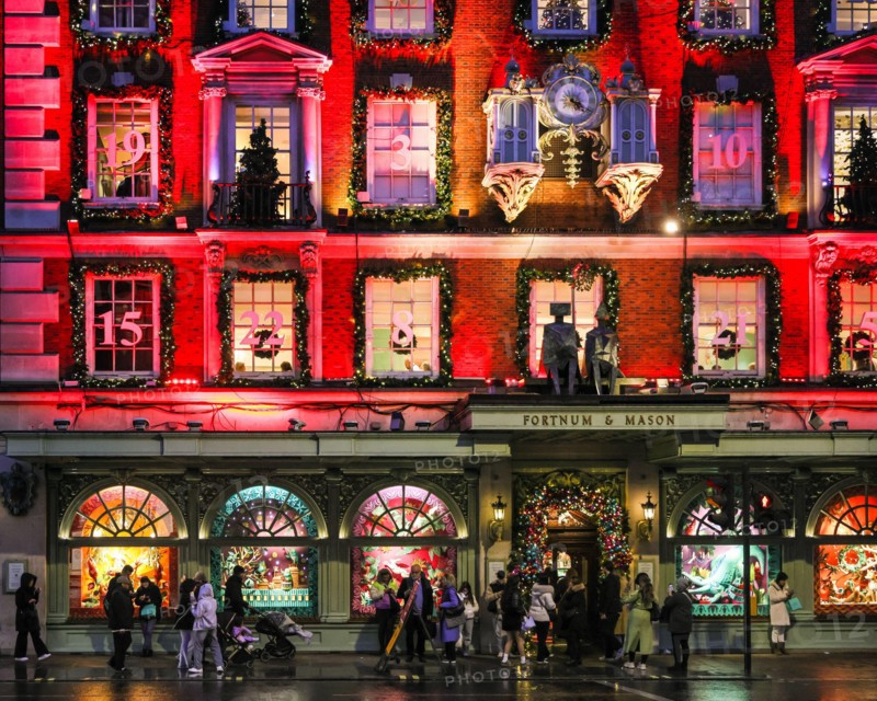 London, UK. 18th Nov, 2024. The annual 'advent calendar' facade decorations and 2024 display glows in festive red on the Fortnum and Mason building in Piccadilly. Christmas Lights, baubles and elaborate decorations have been put up along Bond Street and its luxury shops, Piccadilly, Burlington Arcade and all through Mayfair in anticipation of the the busy Christmas shopping season. Credit: Imageplotter/Alamy Live News
