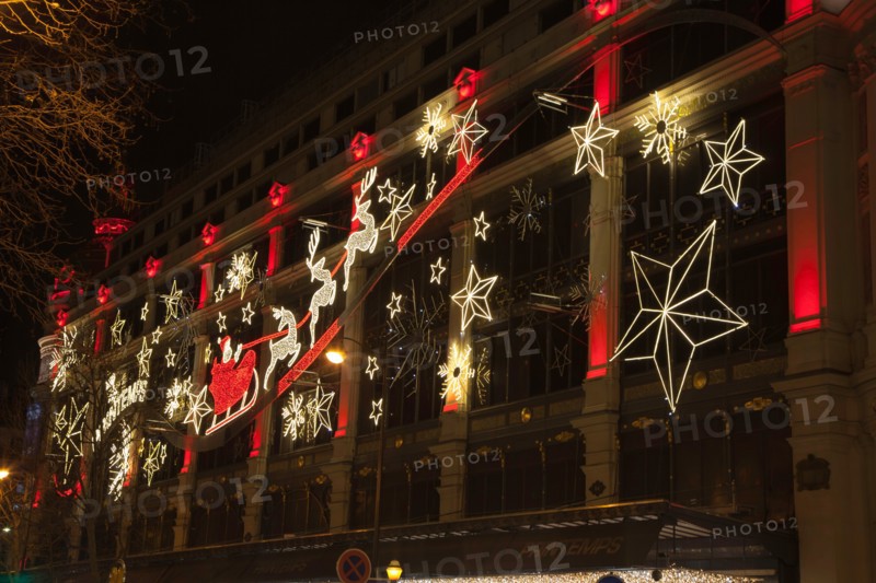 Christmas decorations on the exterior of Printemps department store, Paris, France