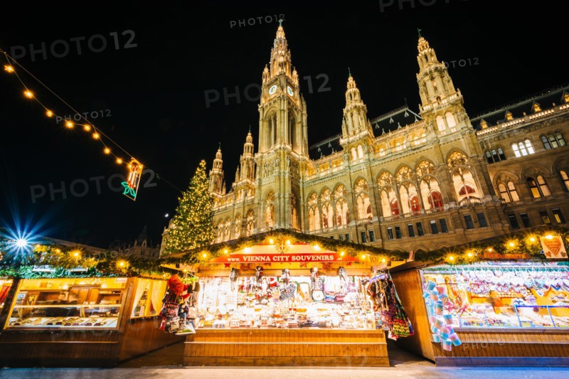 Christmas Market and Rathaus at night, at Rathausplatz, in Vienna, Austria.