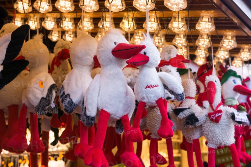 Soft toy storks on sale at Place Broglie Christmas market, Strasbourg