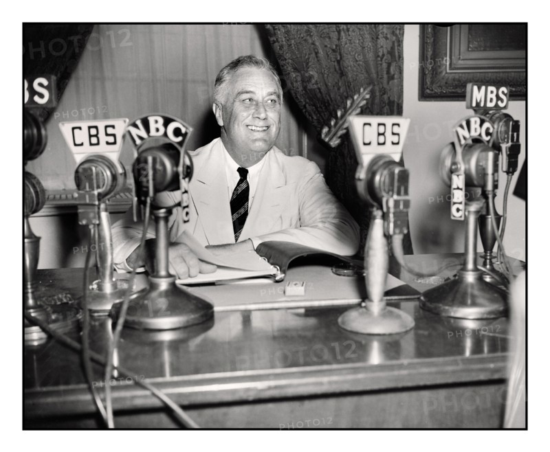 PRESIDENT ROOSEVELT 1930's FDR Franklin D. Roosevelt giving a radio broadcast (“fireside chat”) September 1934. On his desk CBS & NBC network broadcast microphones. Franklin Delano Roosevelt Sr., often referred to by his initials FDR, was an American statesman and political leader who served as the 32nd President of the United States from 1933 until his death in 1945.