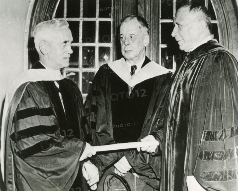 Scottish physician and microbiologist Alexander Fleming (left) receives an honorary degree from Thomas S. Gates, President of the University of Pennsylvania while Dr. Alfred Newton Richards looks on, USA 1945