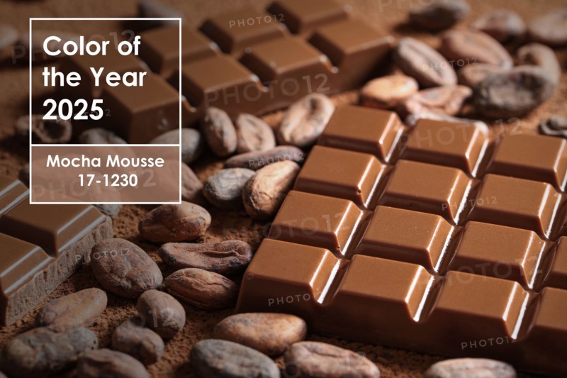 Sweet chocolate with cocoa beans, closeup. Mocha Mousse - color of year 2025