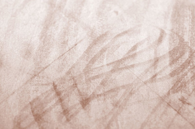 Mocha-Mousse fabric texture with light scuff marks, highlighting the Pantone Color of the Year 2025.