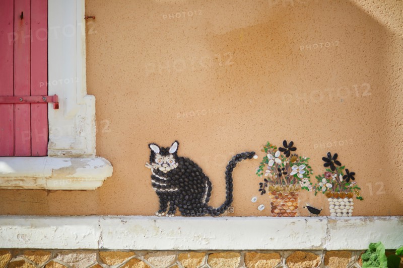 Beautiful art decorations made from shells and pebbles on walls in Ile Penotte, Les Sables d'0lonne of the department of Vendee, Pays de la Loire, Fra