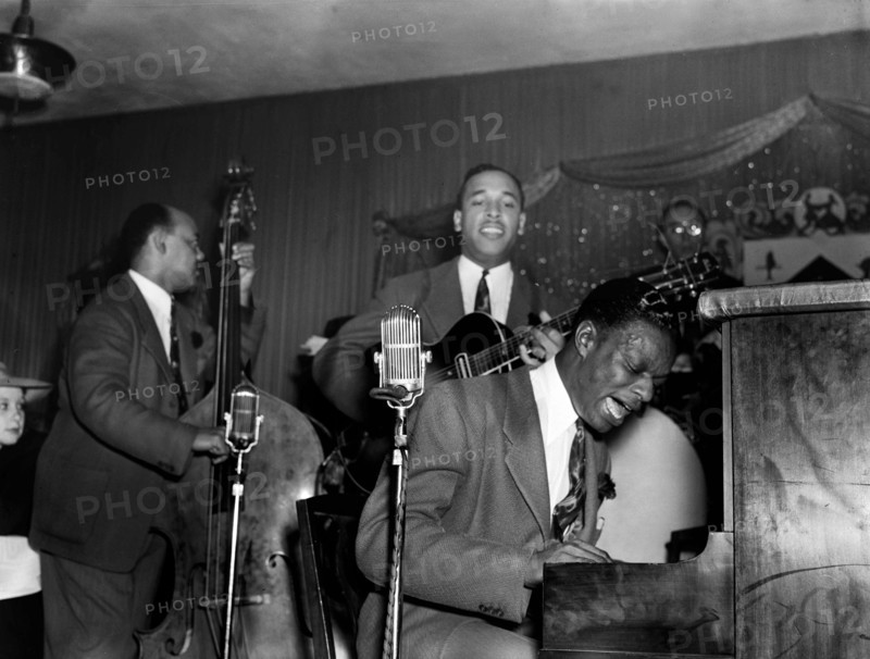 Jazz being played! Portrait of Wesley Prince, Oscar Moore, and Nat King Cole, Zanzibar, Live on stage - New York, N.Y., ca. July 1946 - photo by Gottlieb