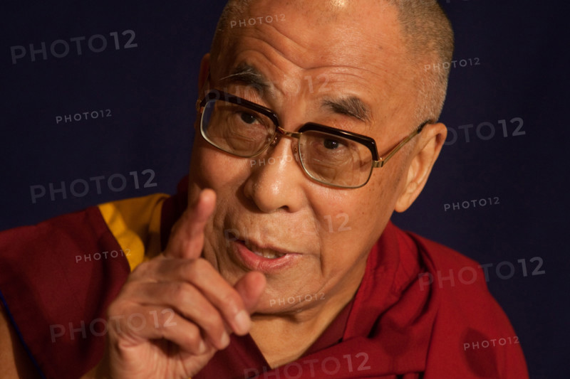 Dalai Lama Tenzin Gyatso, speaking at a function.