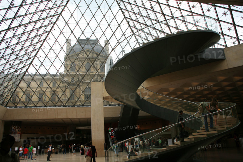 Inside the Louvre pyramid, waiting in queue to buy the ticket