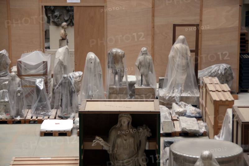 packed statues at the louvre museum in paris france