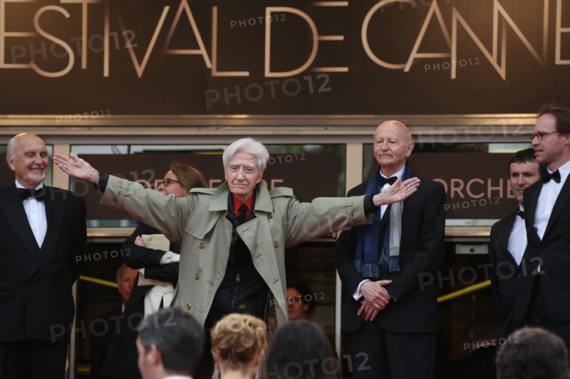 French director Alain Resnais welcomes his cast from the top of the stairs at the premiere of "You Ain't Seen Nothin' Yet" during the 65th Cannes Film Festival at Palais des Festivals in Cannes, France, on 21 May 2012. Photo: Hubert Boesl