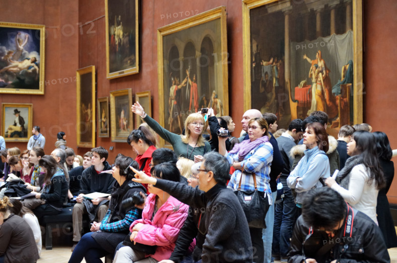 People viewing paintings, Musee du Louvre in Paris, France - Jan 2012