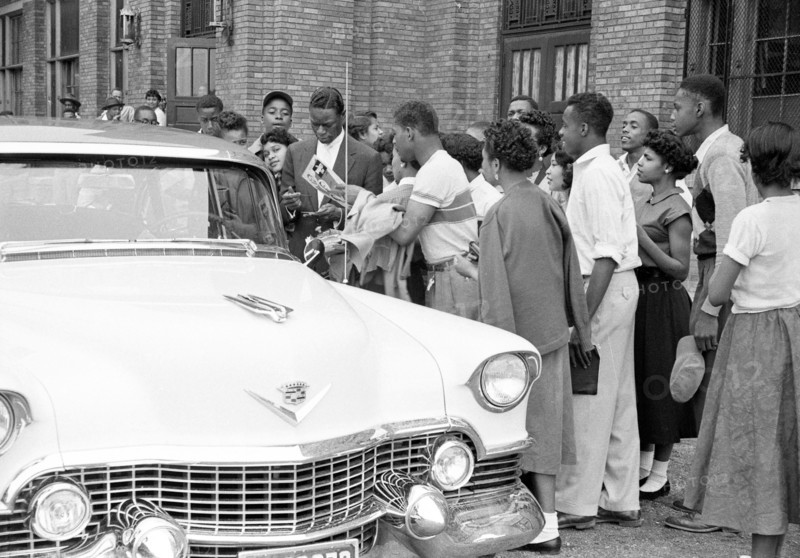 Nat King Cole signing autographs
